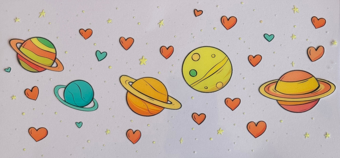 DTF wrap with colorful planets, red hearts, and stars in a cartoon style.