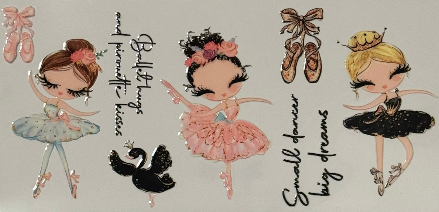 Three ballerinas in colorful tutus with ballet shoes and swan accents.