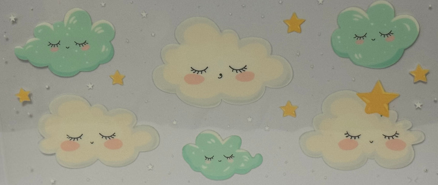 Cartoon pastel clouds with closed eyes and rosy cheeks surrounded by golden stars on a grey background.