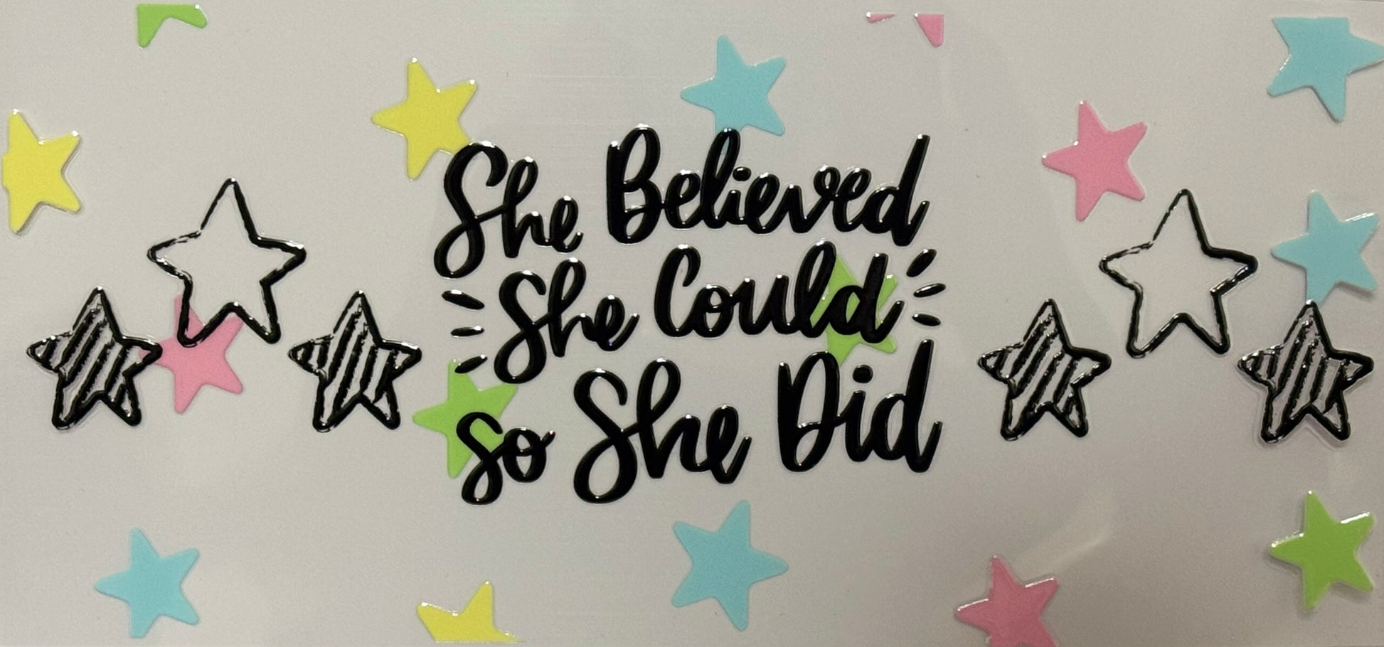 DTF wrap with “She believed she could so she did” text and colorful stars