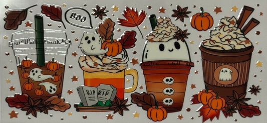 Halloween drinks decorated with ghosts, pumpkins, whipped cream, and fall leaves.
