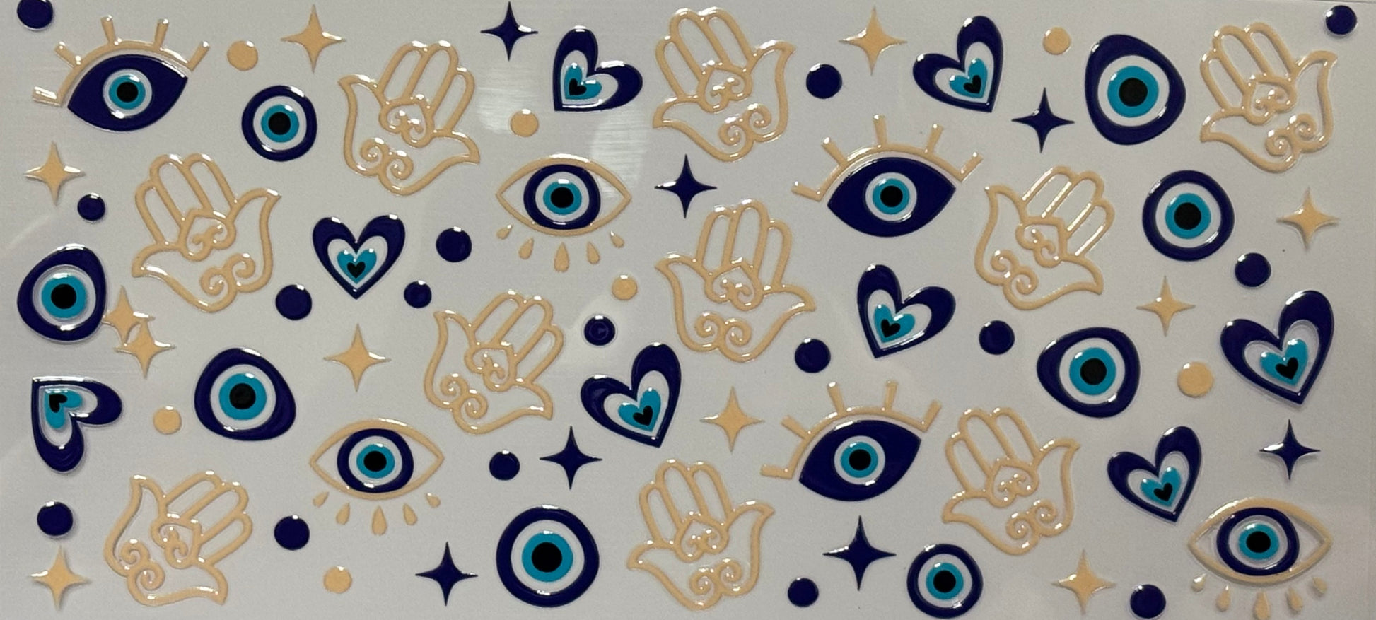 DTF wrap with blue evil eyes, hamsa hands, stars, and hearts