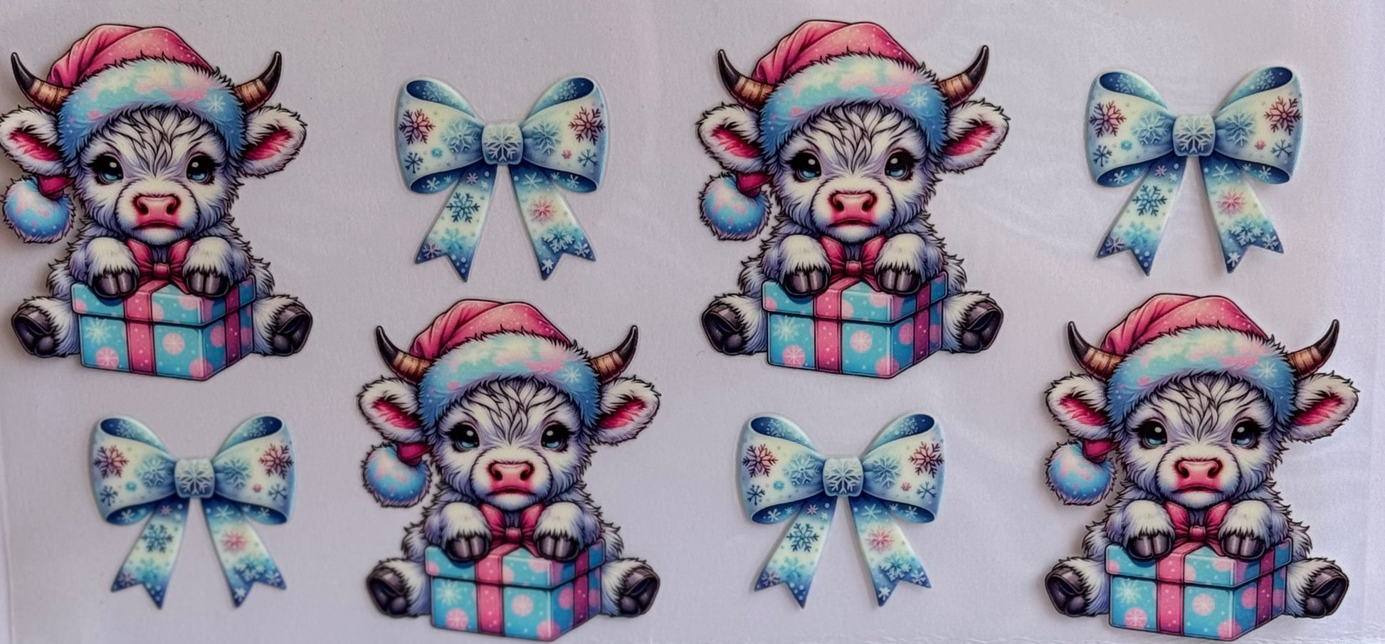 Christmas cow DTF wrap with Santa hats, presents, and pastel bows in pink and blue.